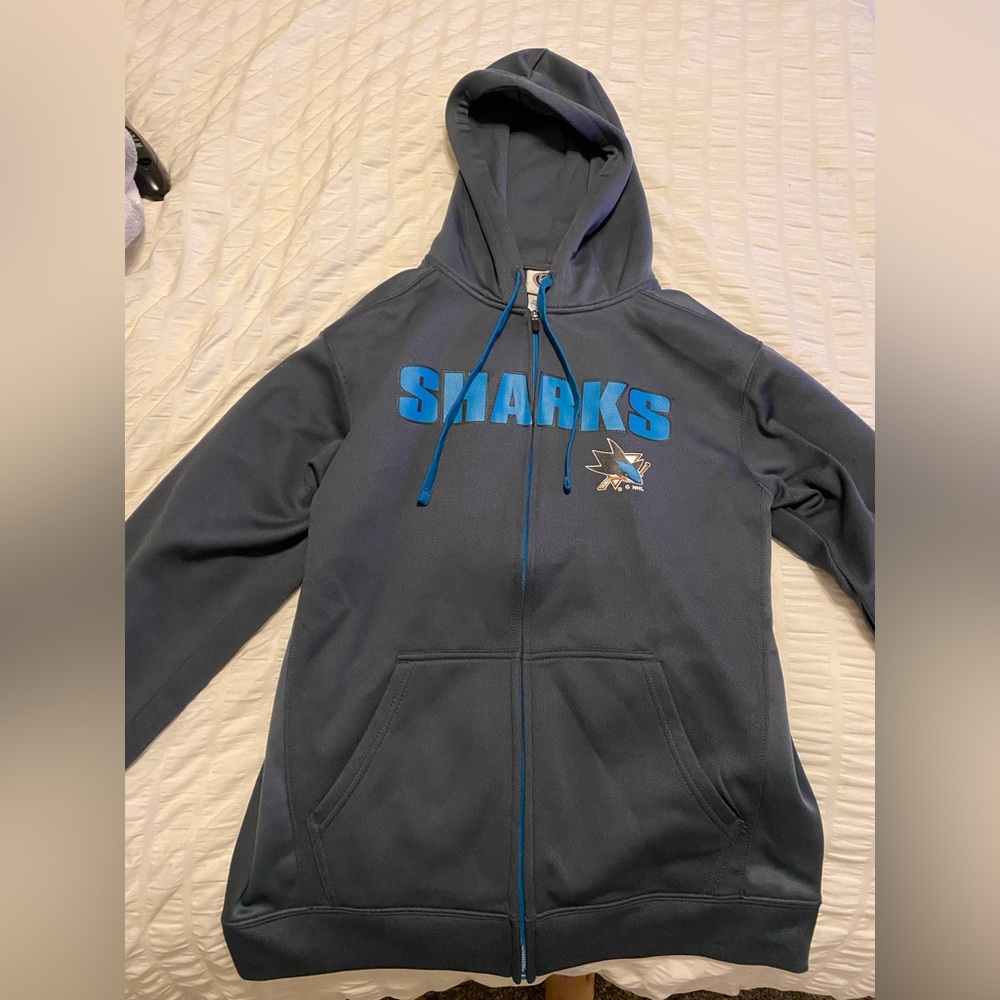 San Jose sharks sweater.